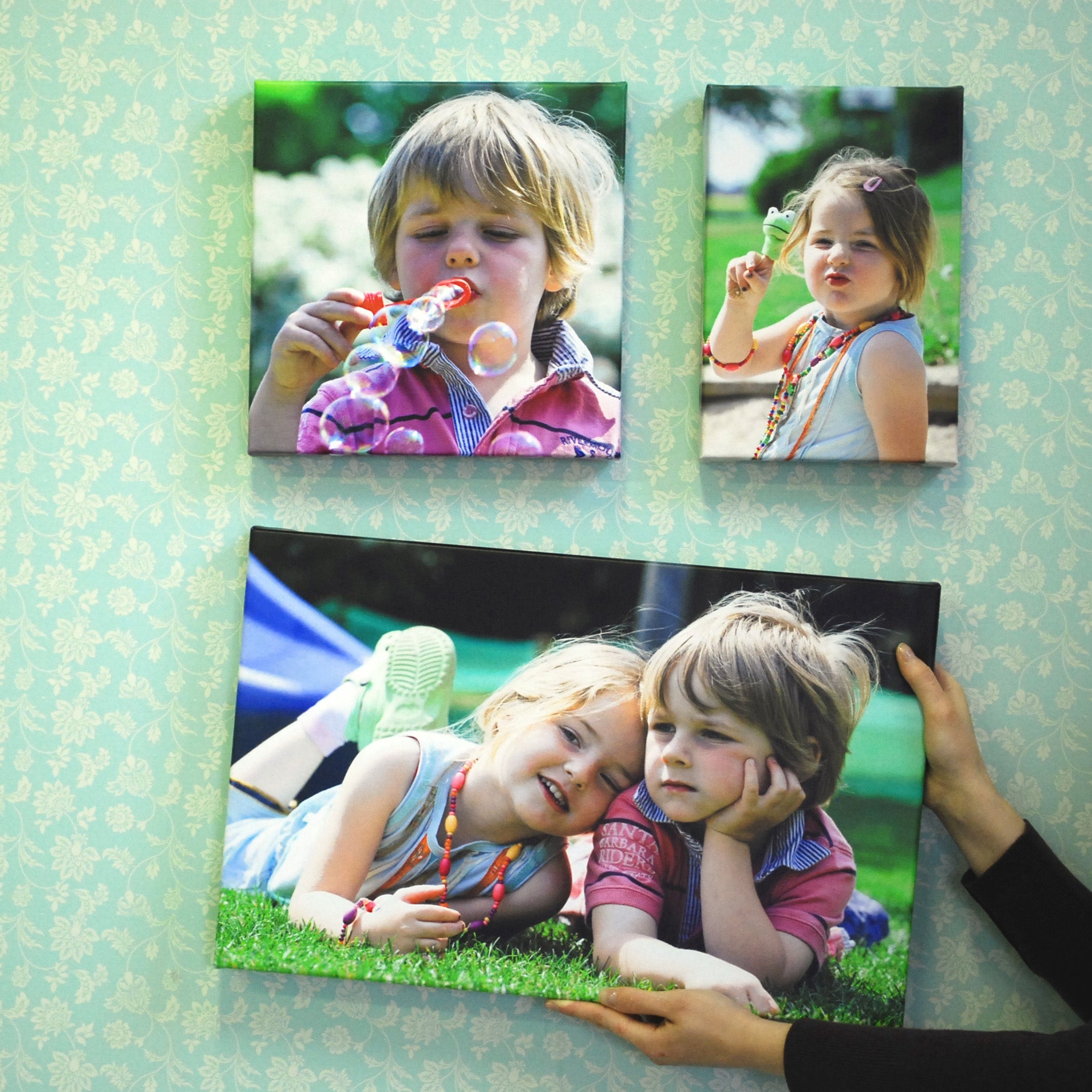 Various Sizes of Canvas Photo Prints Being Displayed on a Wall