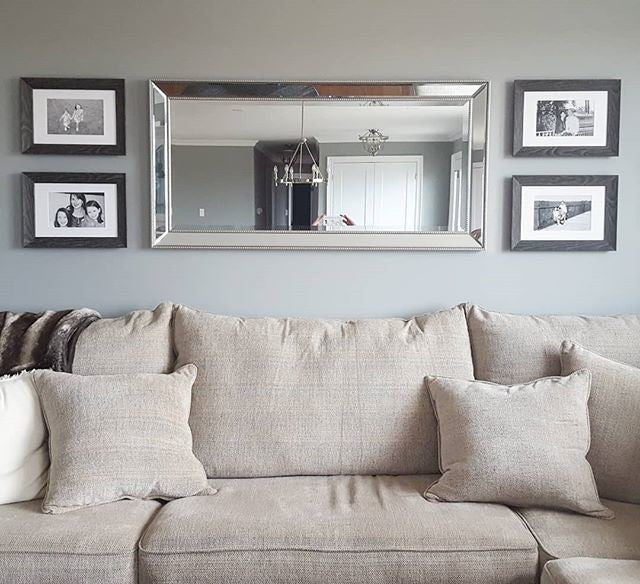 Featured Gallery Wall of Family Photos in Living Room