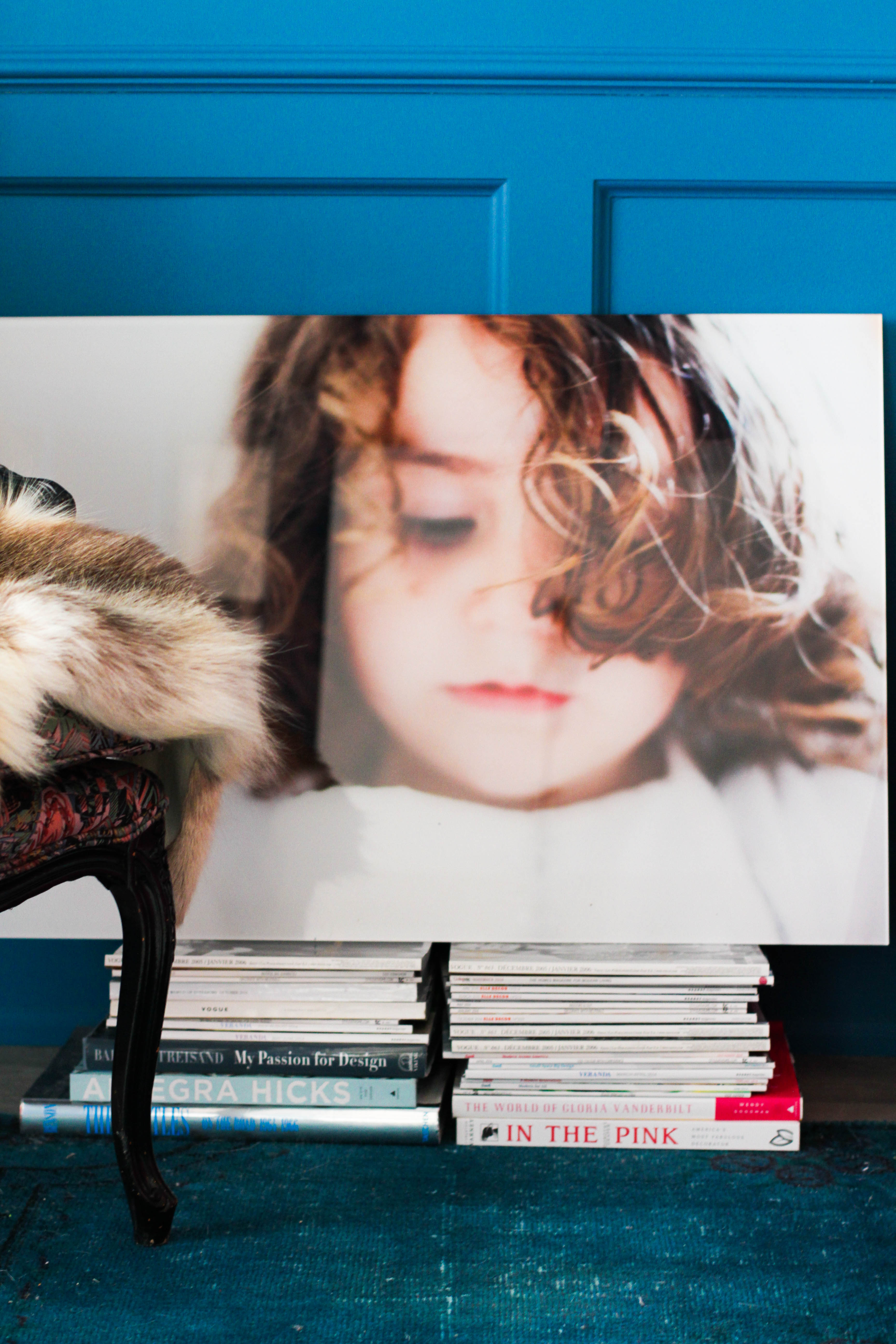 Displaying photo art on top of a stack of magazines