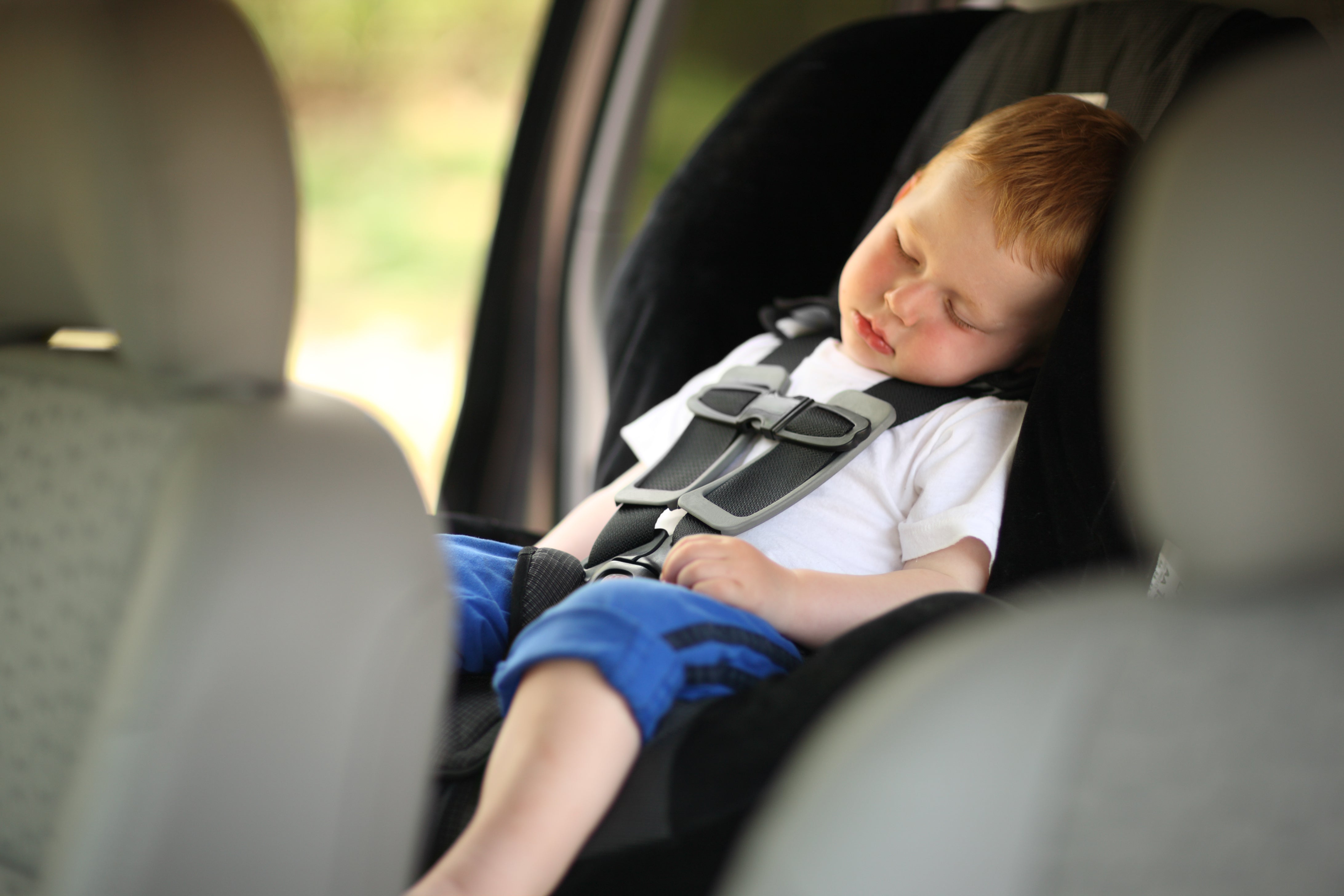 Baby toddler sleeping in the carseat 