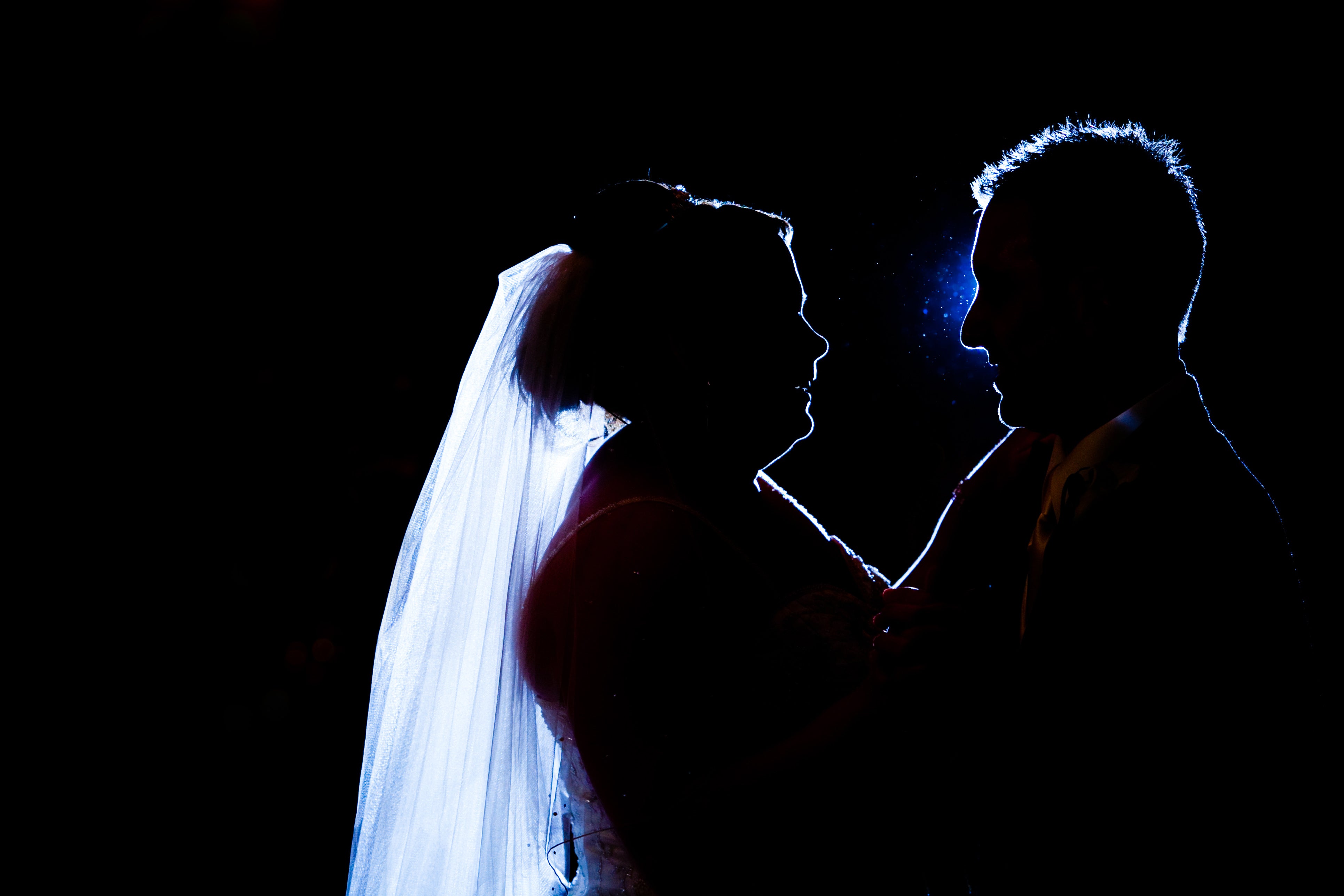 Silhouette of bride and groom having their first dance