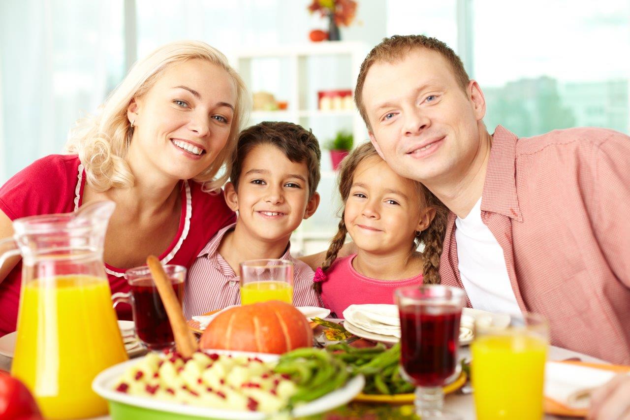 Group photo of family before a holiday meal