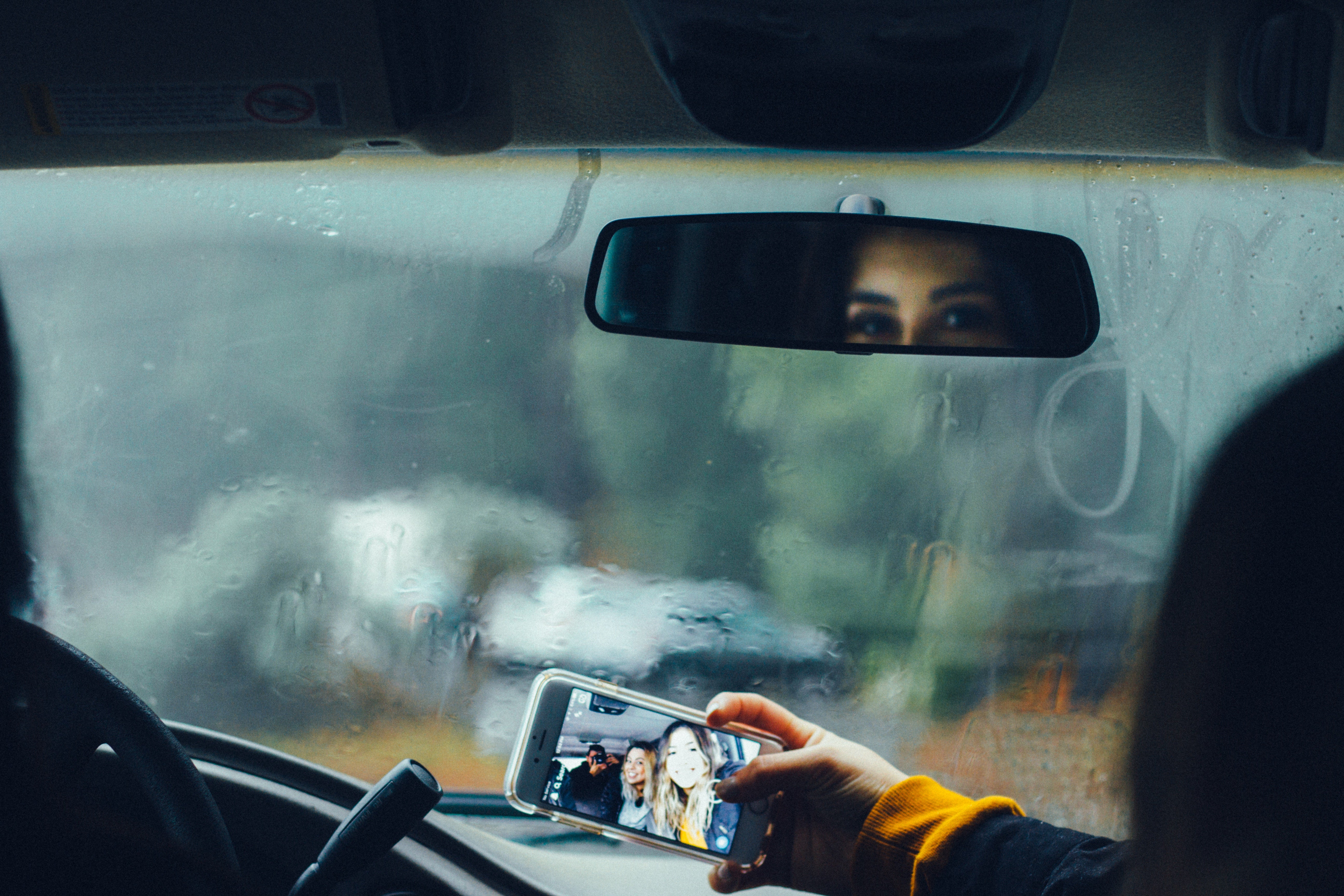 Taking a family selfie on a road trip in the car