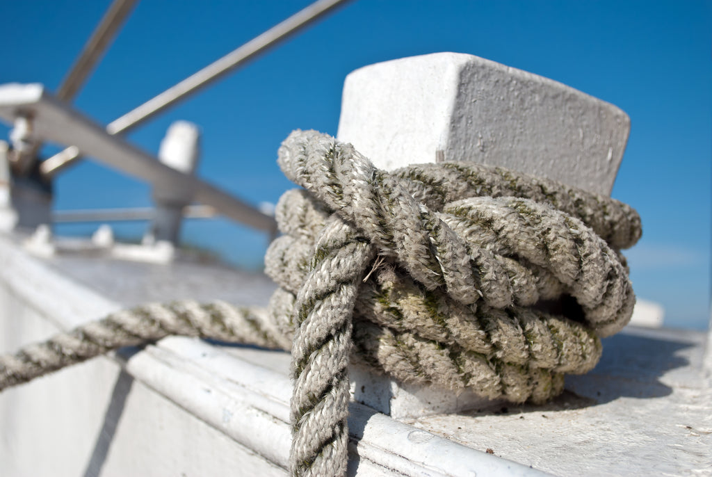Close-up photo of rope tied to a boat on the ocean