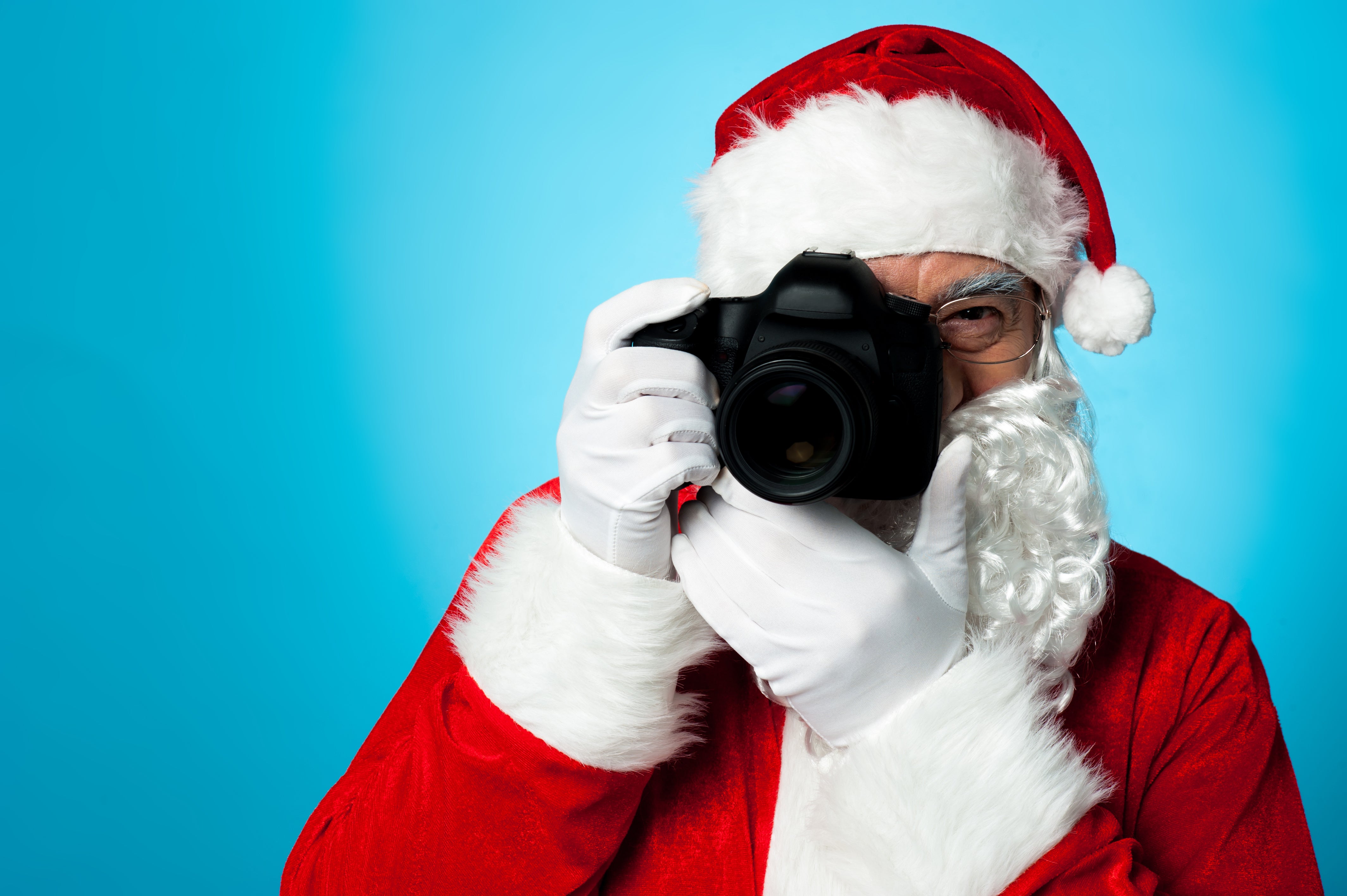 Santa holding a digital camera