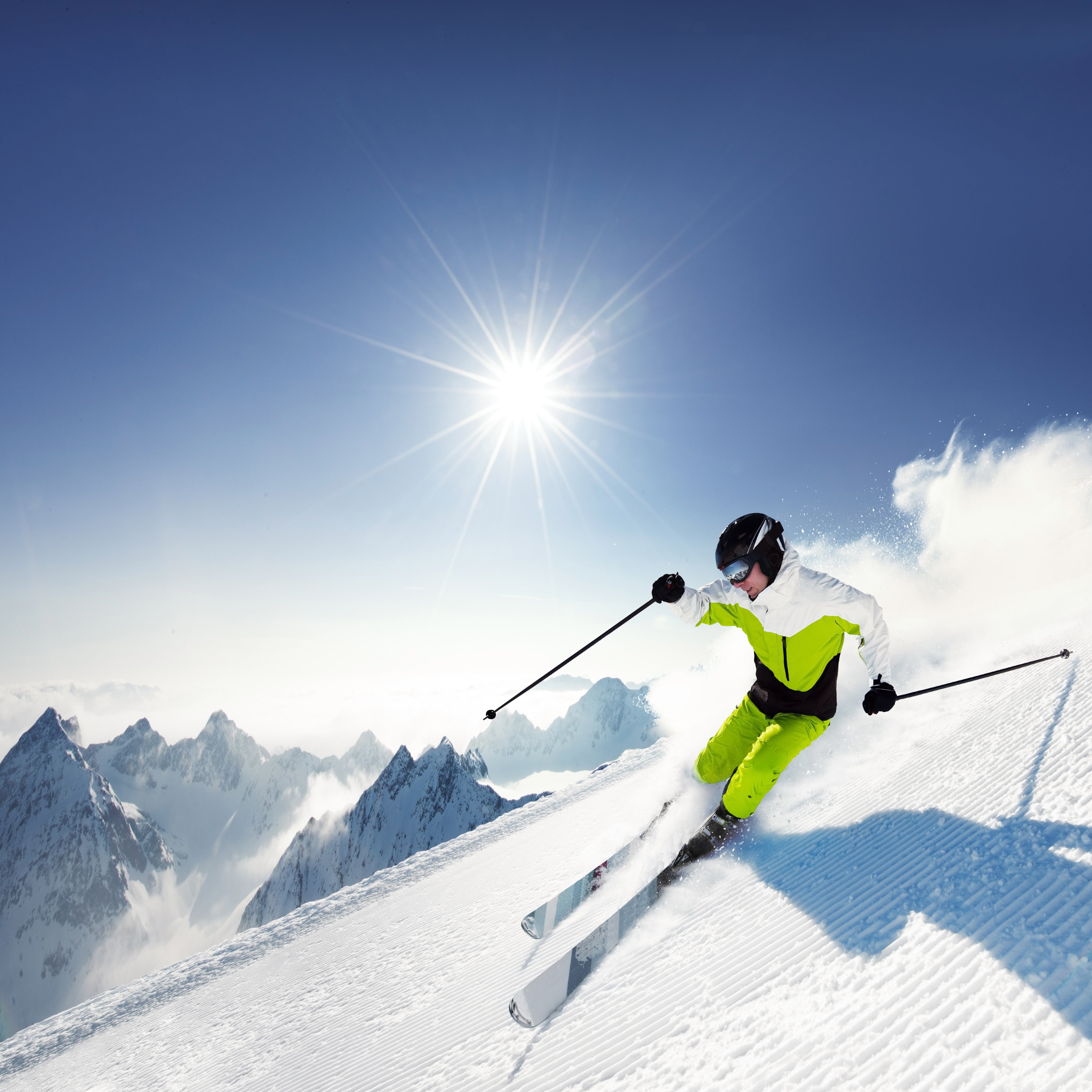 Person skiing on a bright, sunny day - example of holiday photography