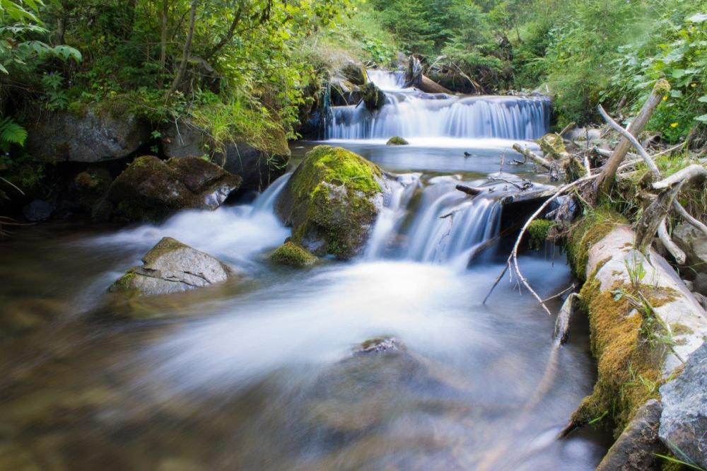 A small, beautiful waterfall captured with a slow shutter speed