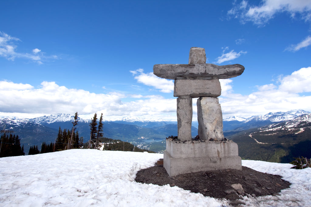 Snowy Canadian landscape photo with Inukshuk 