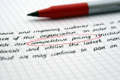 Red pen circled competitive pricing