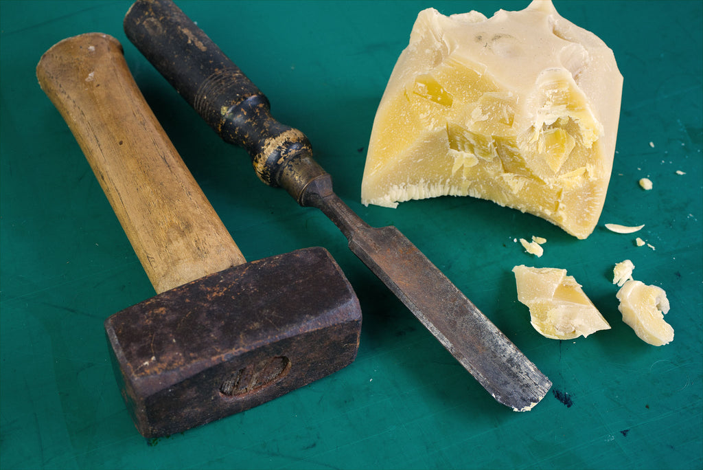 Beeswax block broken up with hand tools in order to make Formula 5 wax