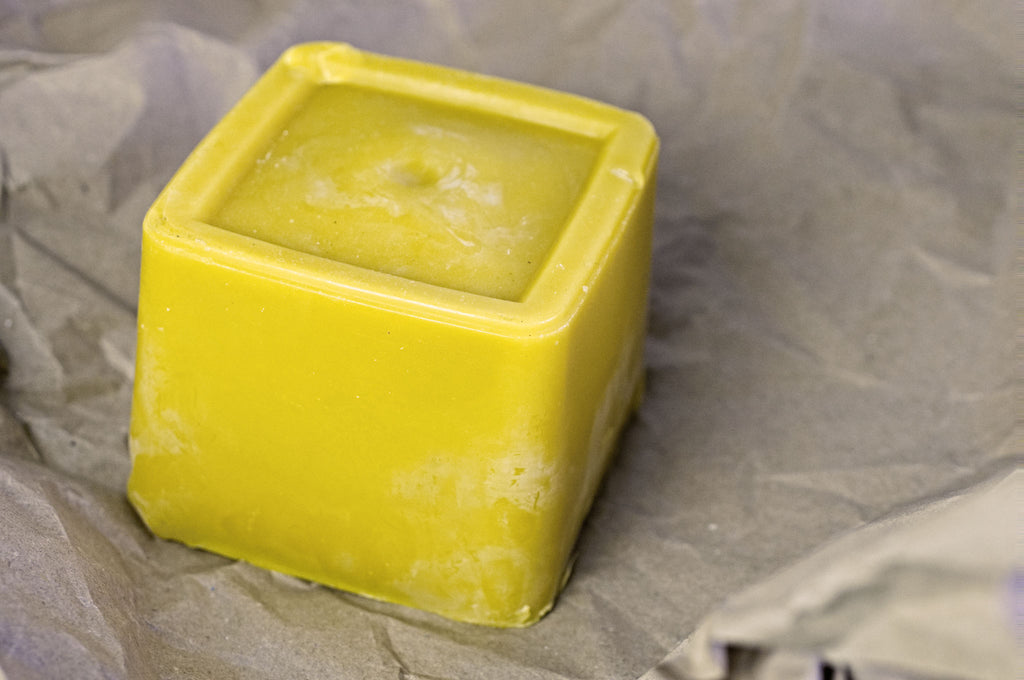 100% pure UK beeswax....... definitely poured into a butter tub.