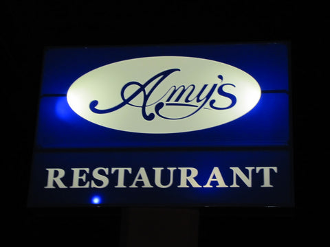 Amy's Restaurant Sign lit up at night with 24 volt solar system