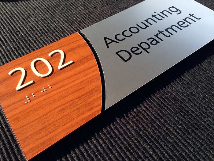 Wood laminate and brushed aluminum ADA Signs from ADA Sign Depot