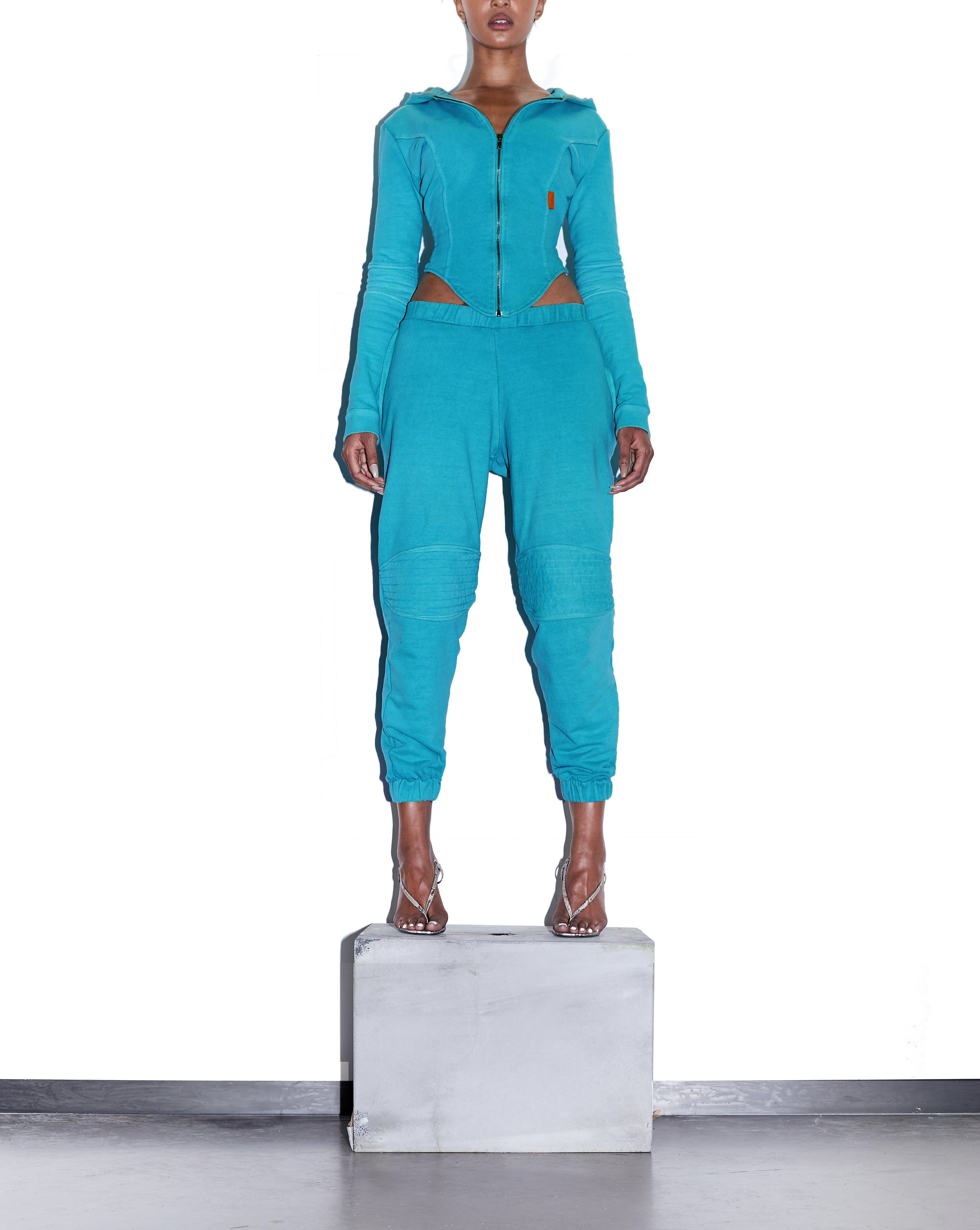 Model wears SIZE X-SMALL TONIK Slouch Panelled Joggers in Azure Blue by TheKLabel