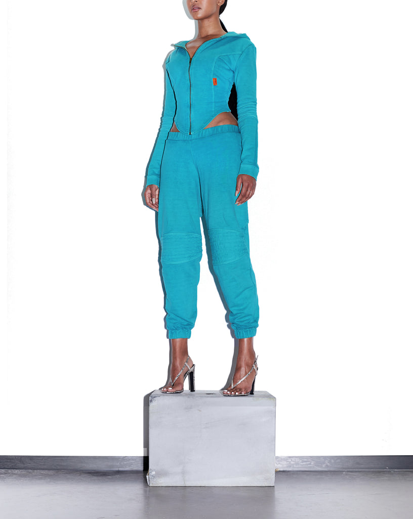 Model wears SIZE X-SMALL TONIK Slouch Panelled Joggers in Azure Blue by TheKLabel