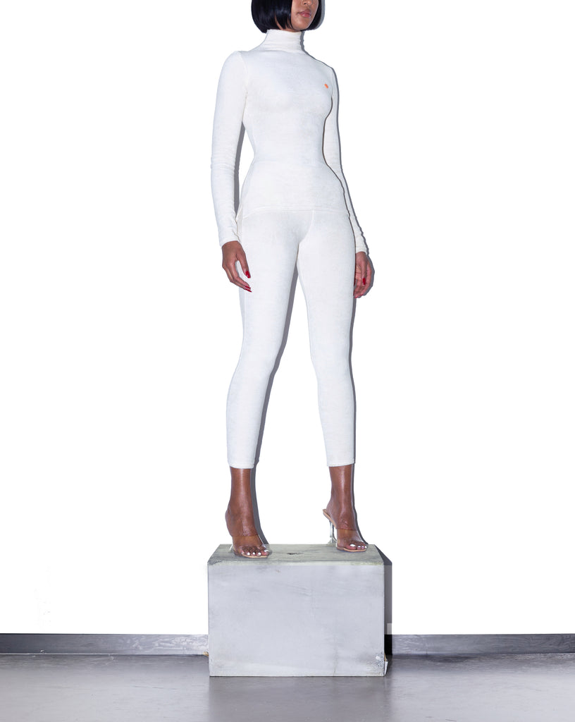  Model wears XS KOOTCH Towelling Base Layer Top in Buttermilk by TheKLabel