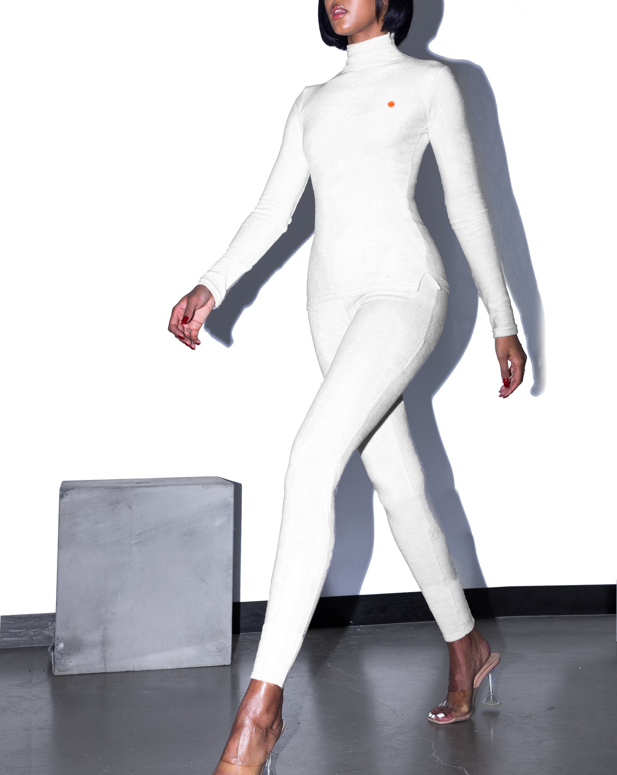 Model wears XS KOOTCH Towelling Base Layer Leggings in Buttermilk by TheKLabel (motion)