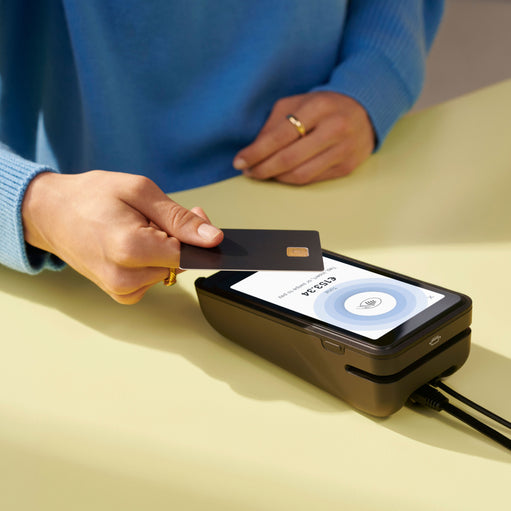 Image of a POS credit card reader making a transaction