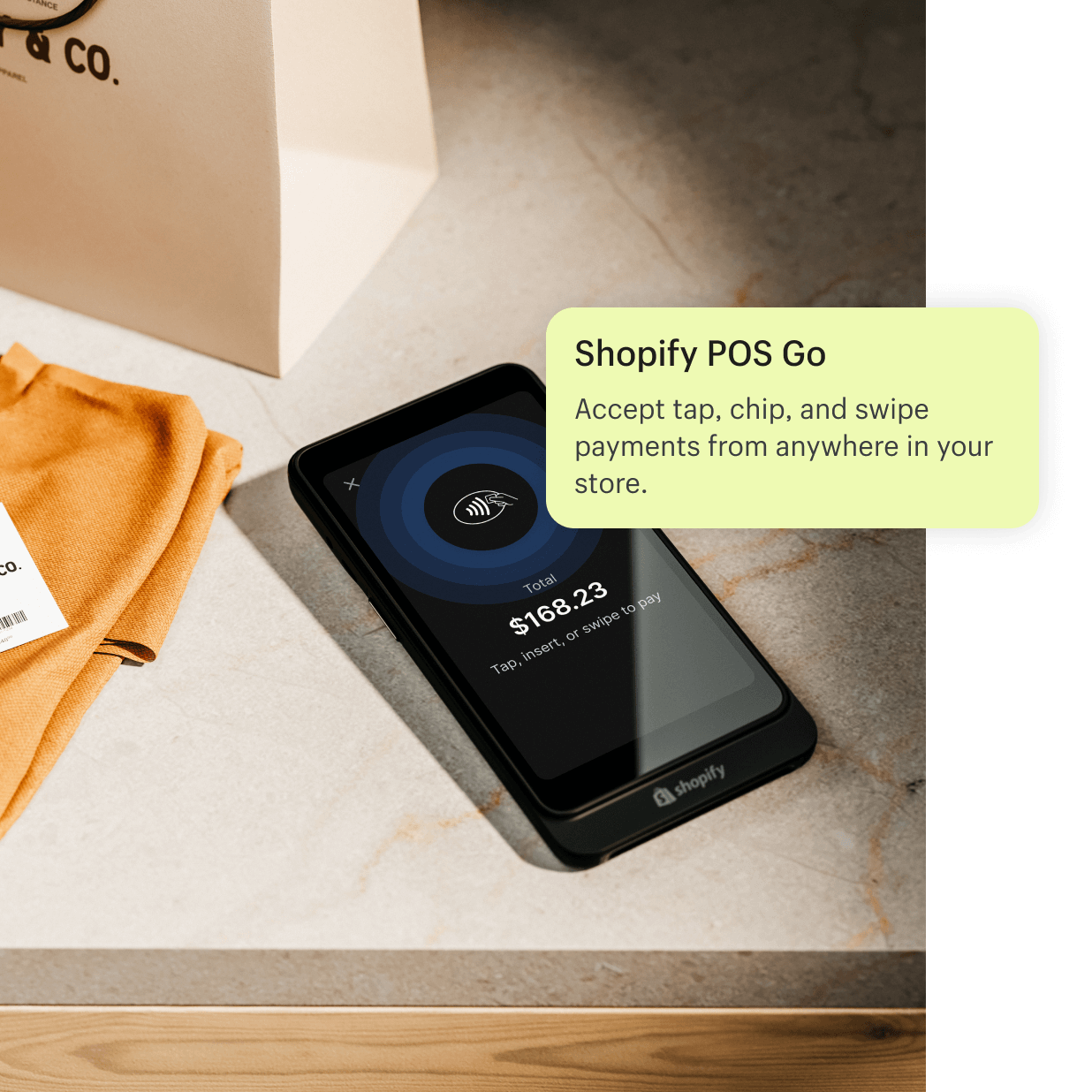 An image of the POS Go device placed on a counter after completing a transaction with a customer. The POS Go is Shopify’s mobile point of sale that accepts tap, chip, and swipe payments.