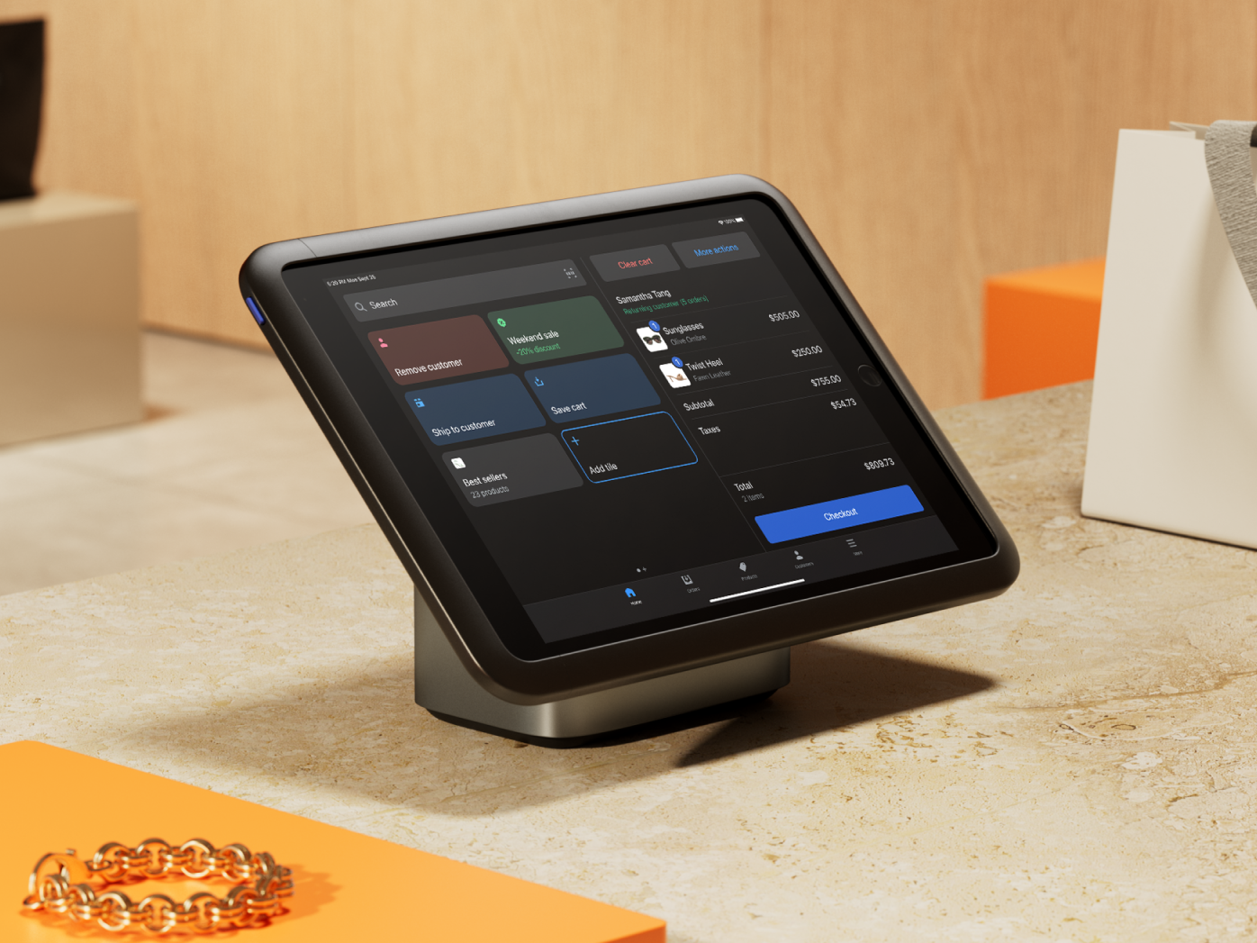 Tablet running Shopify Point of Sale on a sales counter.