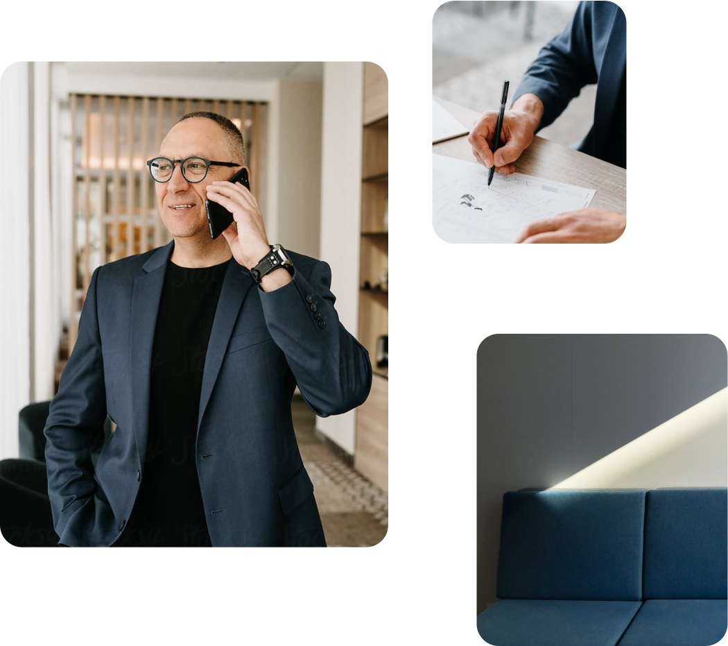 A middle-aged white man in a dark, navy suit speaking on his smartphone and signing financial documents for his furniture retail business.