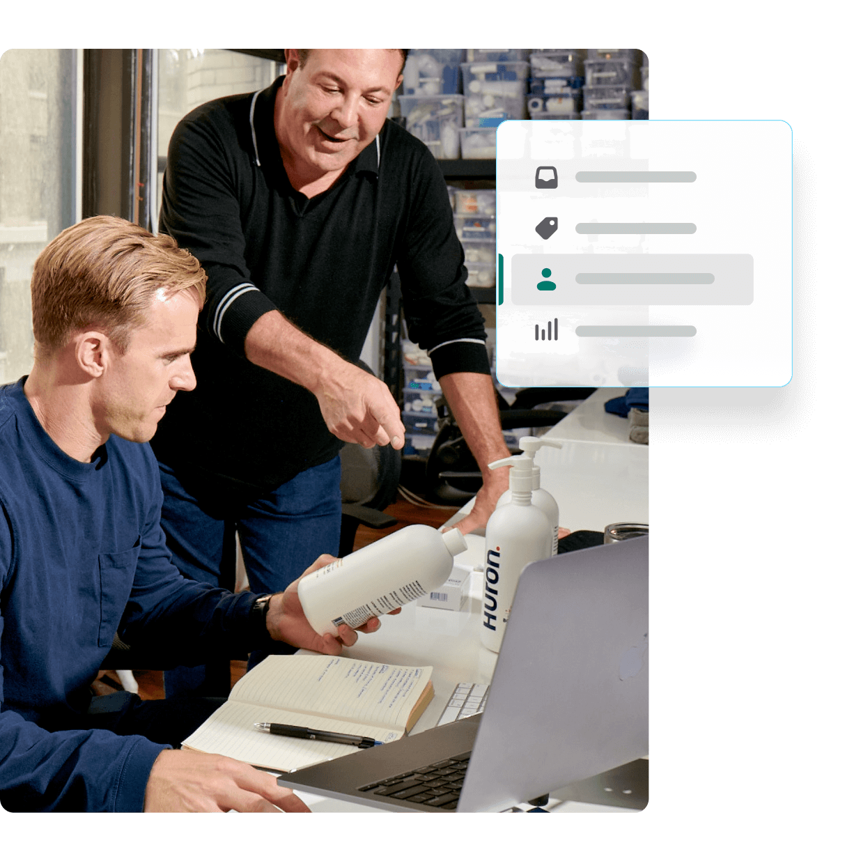 Two men examine product samples in front of a computer, with UI screenshots reflecting Net 30 payment terms and a company dashboard.