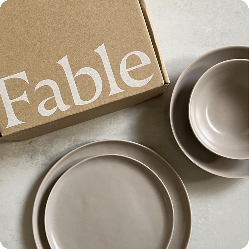 Earth-tone ceramic dinner plates and bowls from the brand Fable.