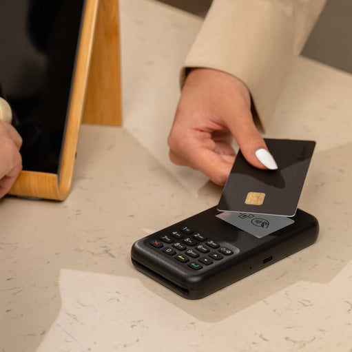 Image of a POS credit card reader making a transaction