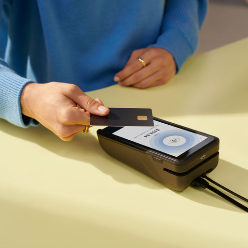 Image of a POS credit card reader making a transaction