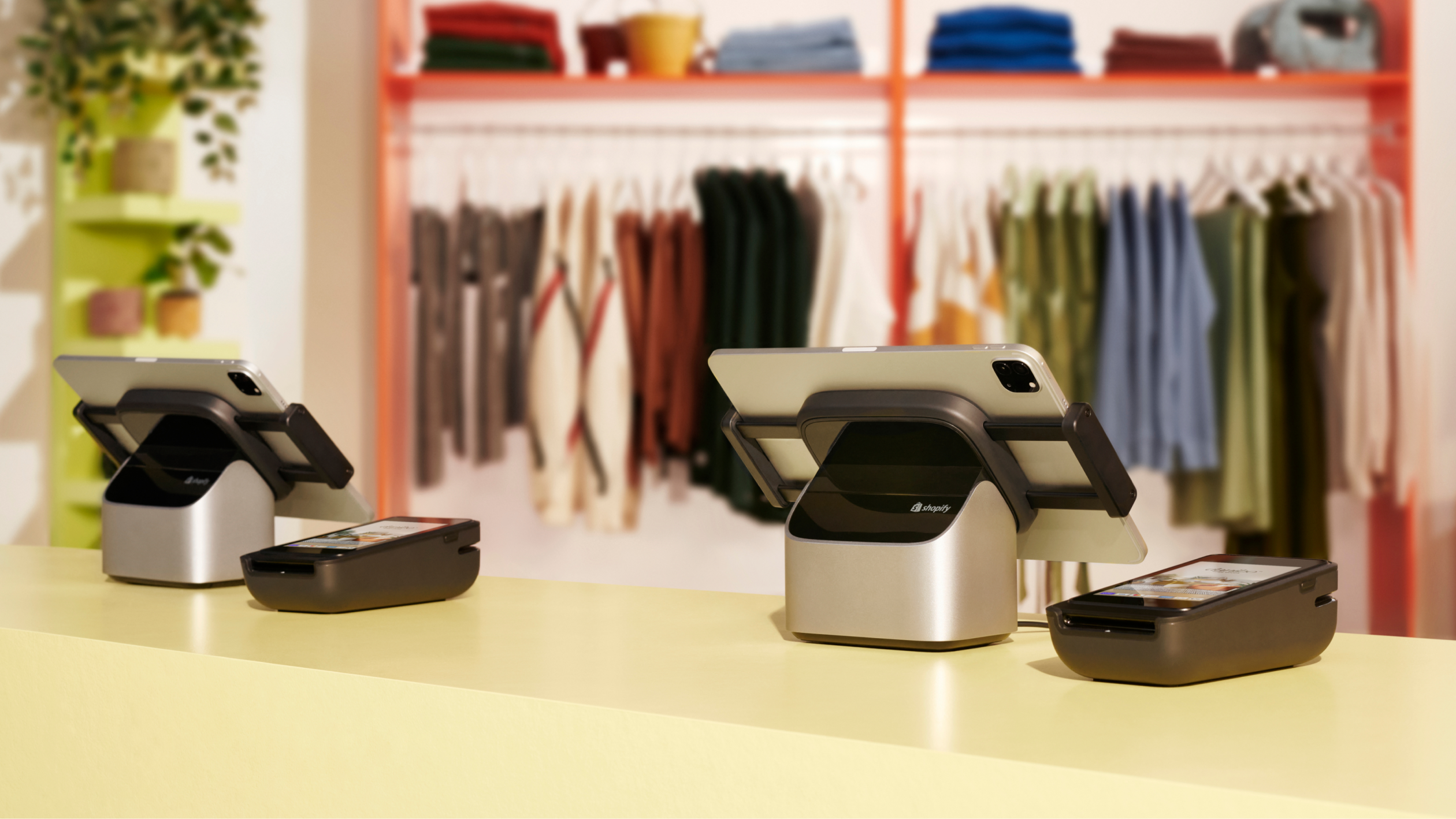 POS hardware from Shopify's Retail Collection is displayed on a retail counter. It includes POS Terminal and Tablet Stand. The tablet is sold separately.