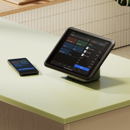 Image of a phone and POS device on a store countertop