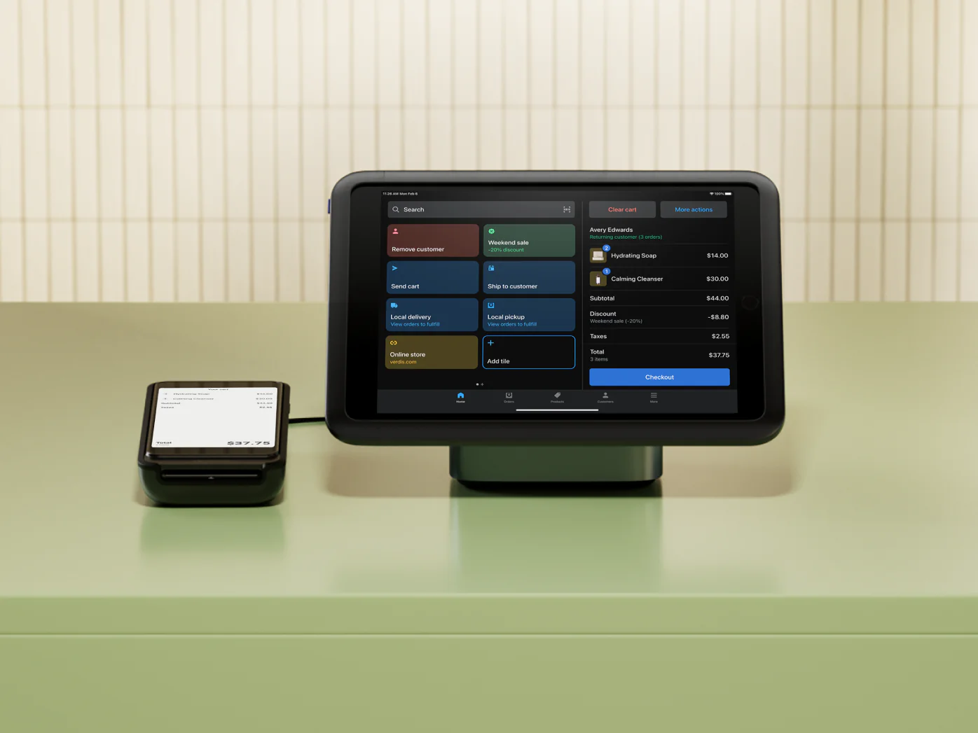 Tablet running Shopify Point of Sale on a sales counter.