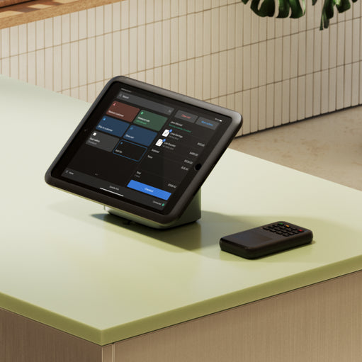 Image of a phone and POS device on a store countertop