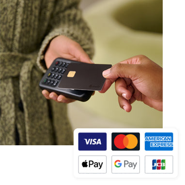 A customer makes a payment by tapping their credit card on WisePad. Above the image appear the logos for the following accepted payment types: VISA, MasterCard, American Express, Apple Pay, Google Pay, and JCB.