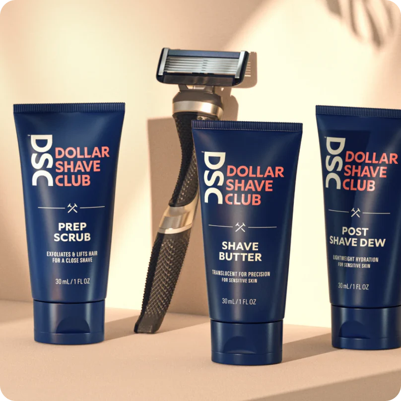 Image of a shaver and various scrubs and creams from Dollar Shave Club