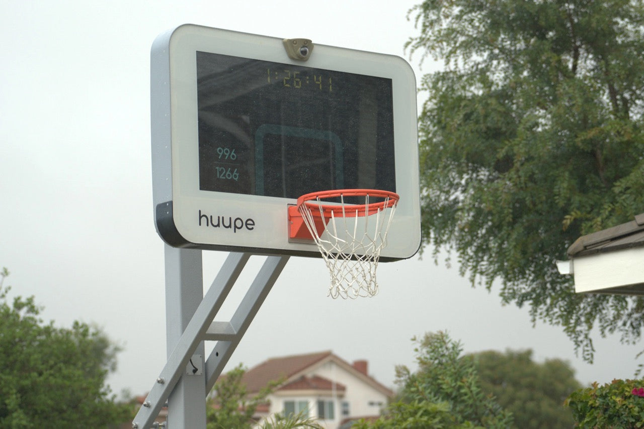 the huupe with the screen on the backboard tracking shots of a user at a home