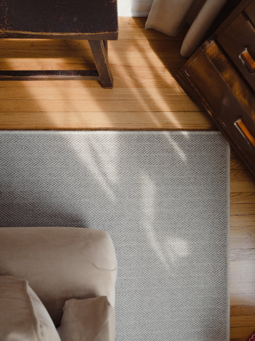 Corner of rug layed down on the floor