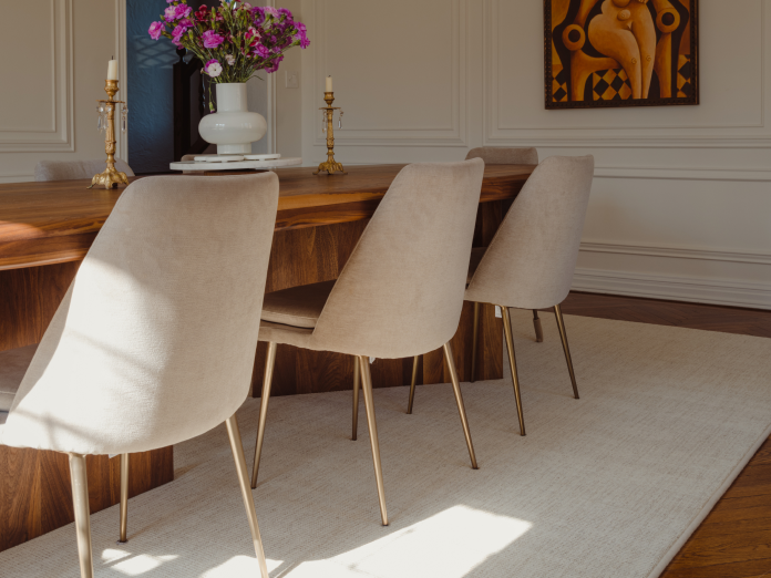 White rug underneath dining room table and chairs