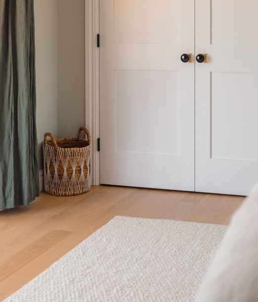 Corner of Cormac rug inside bedroom