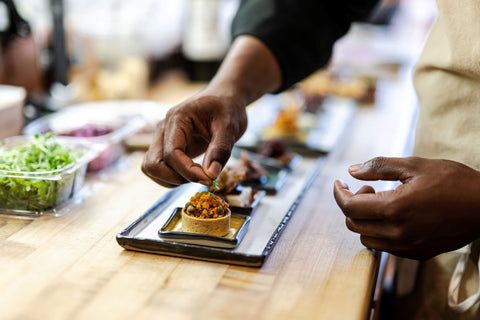 Chef Aaron LeRoi prepping food pairing