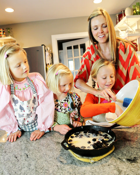 mother and her 3 daughters baking together