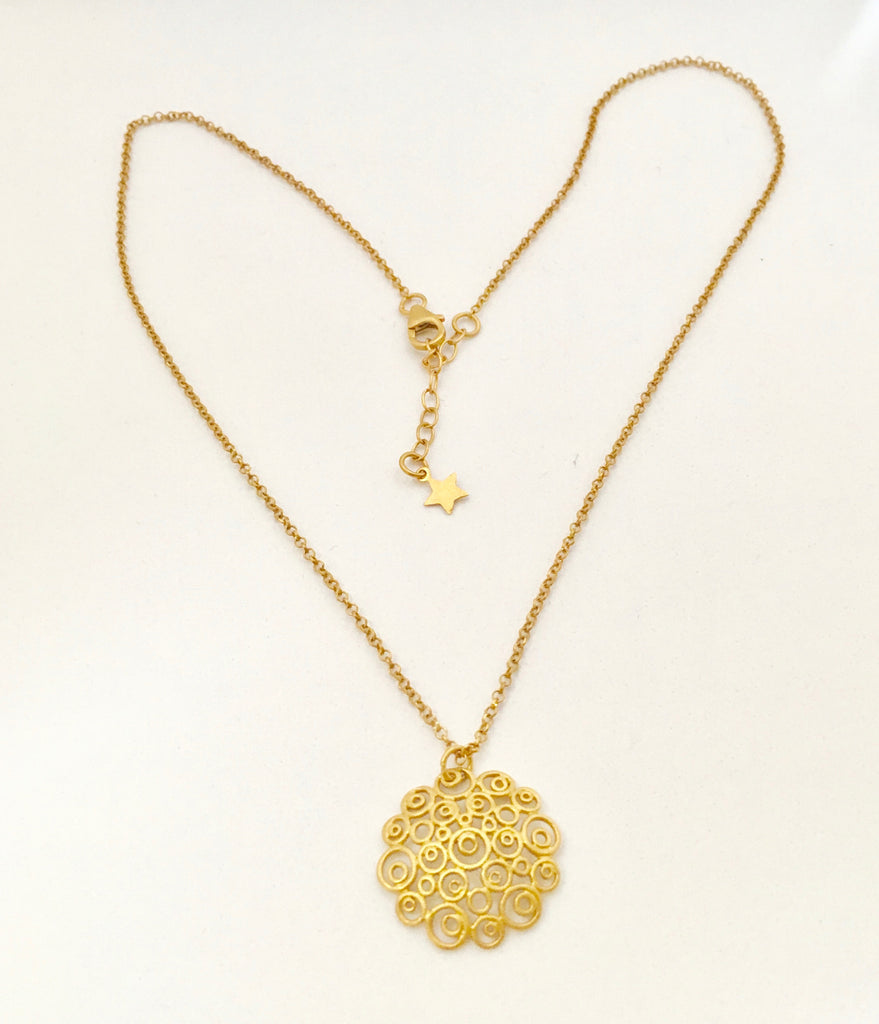 gold necklace and pendant