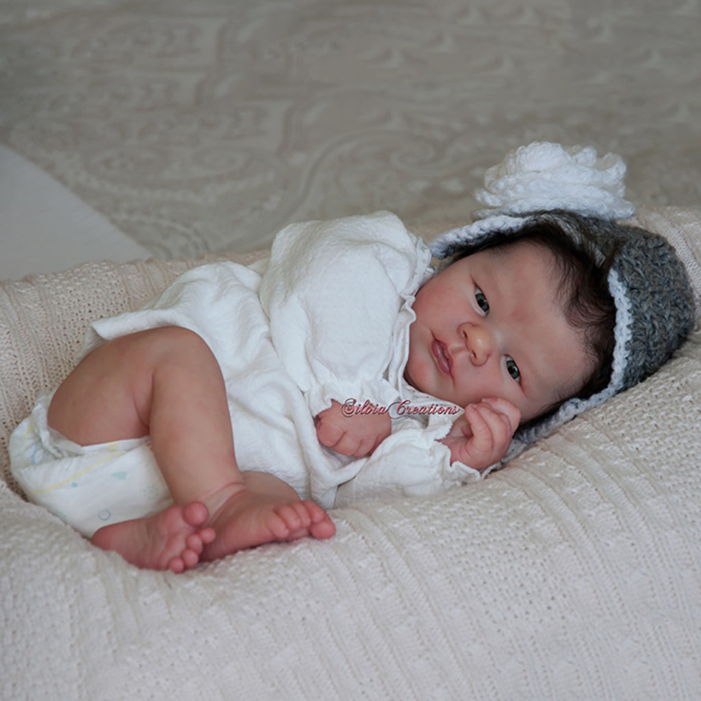 la newborn with accessories