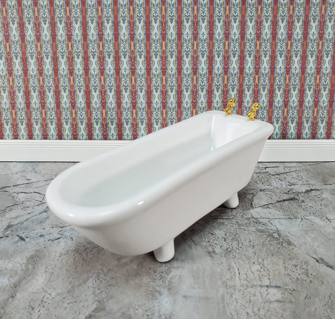 https://cdn.shopify.com/s/files/1/0001/9025/1052/products/dollhouse-bathtub-gold-faucets-white-ceramic-112-scale-miniature-bathroom-tub-164384.jpg?v=1686412799&width=1080