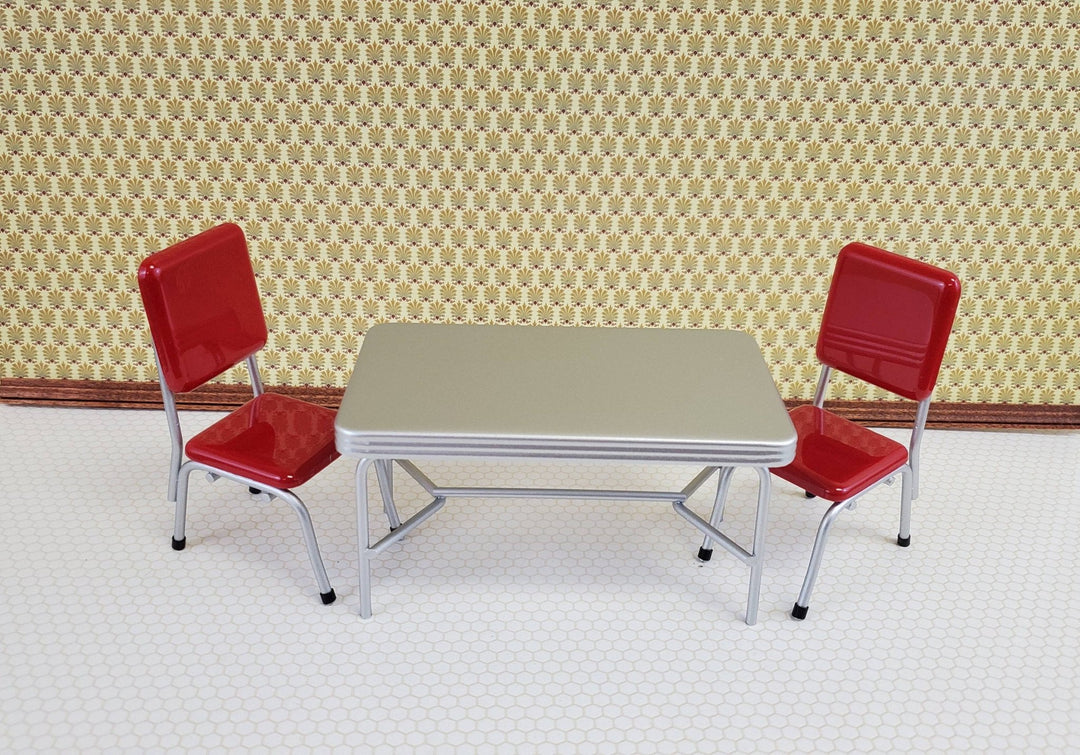 https://cdn.shopify.com/s/files/1/0001/9025/1052/products/dollhouse-miniatures-1950s-style-kitchen-table-with-2-red-chairs-112-scale-677217.jpg?v=1686417690&width=1080