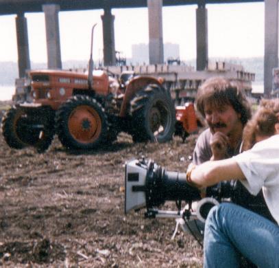 Stan discusses project with a television news crew.