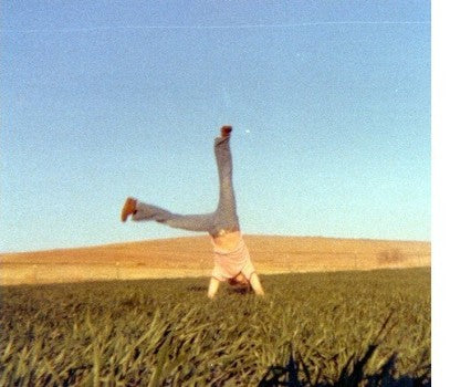 Steve does cartwheels in during our first harvest in April 1977.