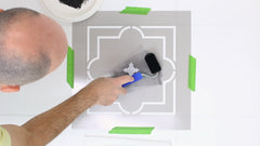 Roll paint through stencil