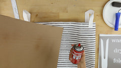 Spray the cardboard for stenciling