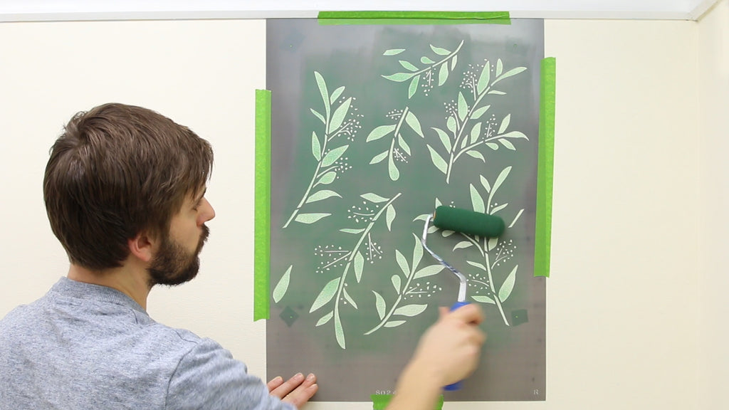 Roll paint through the stencil in several light coats to build the color gradually